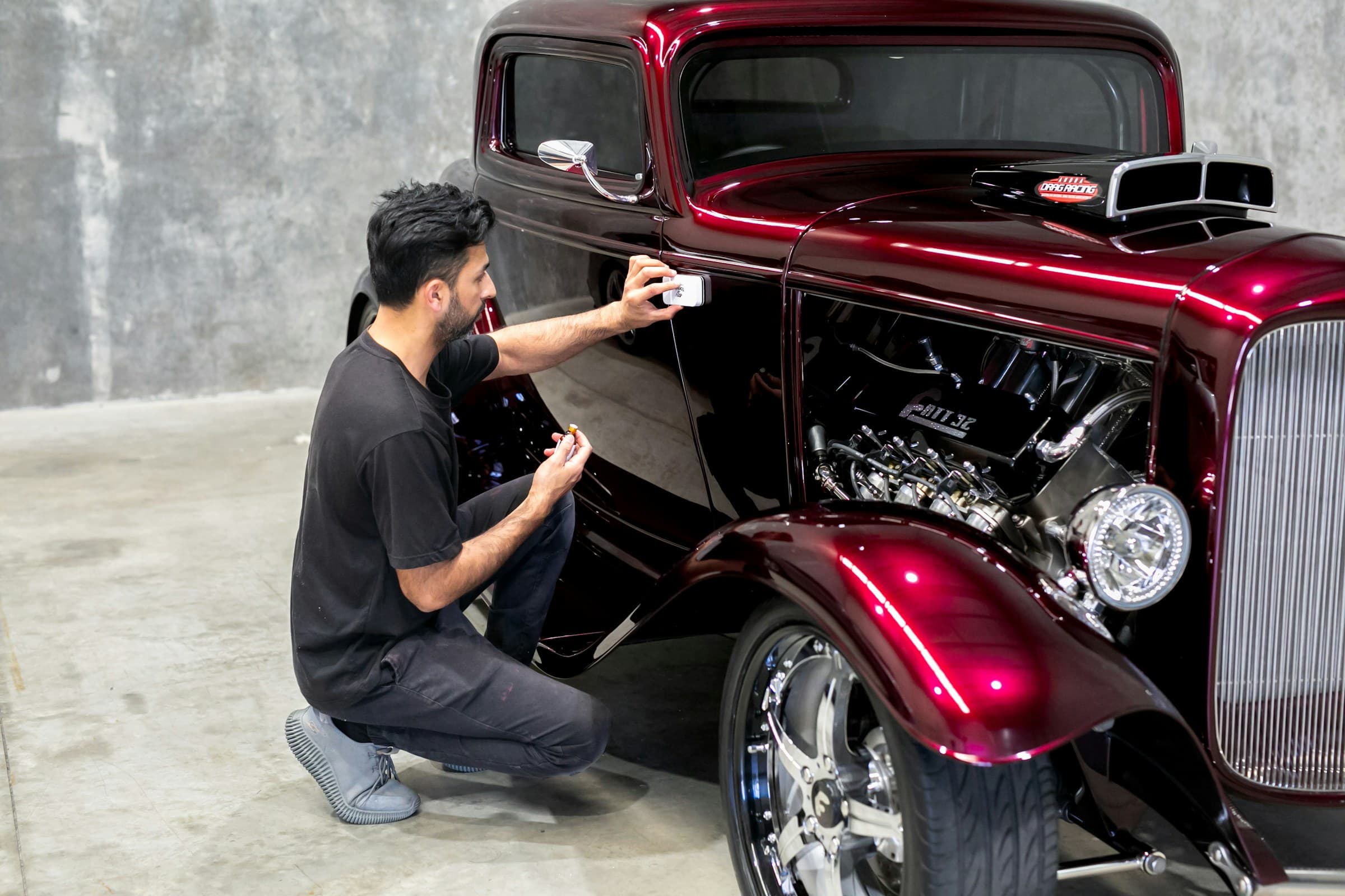Automotive quality specialist inspecting a vehicle